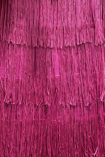 Close-up of purple fabric with fringes