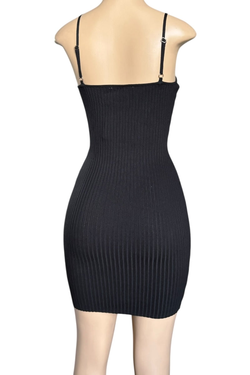 Black ribbed dress on a mannequin against a white background
