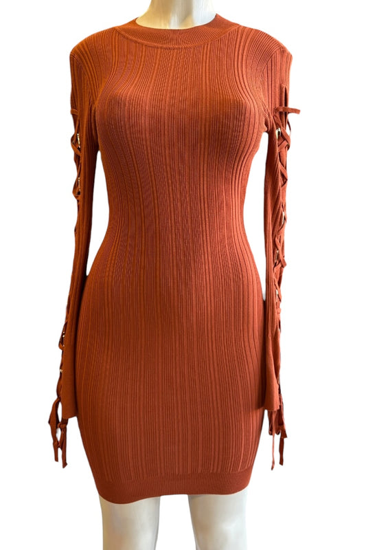 rust ribbed dress with lace-up sides on a mannequin against a white background