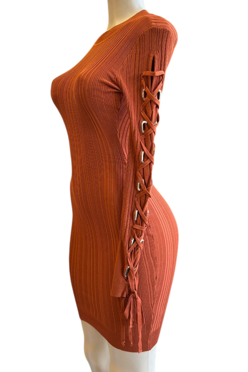 rust ribbed dress with lace-up front on a mannequin against a white background
