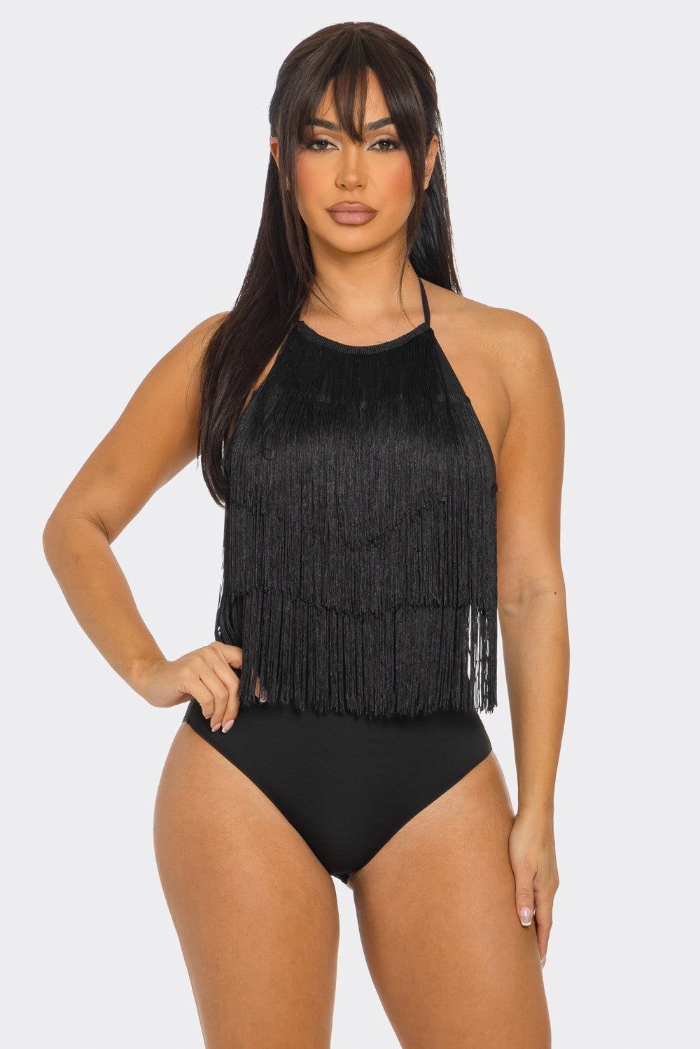 Woman wearing a black fringe bodysuit on a white background