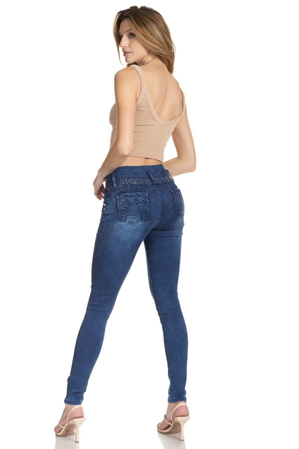 Woman wearing blue jeans on a white background