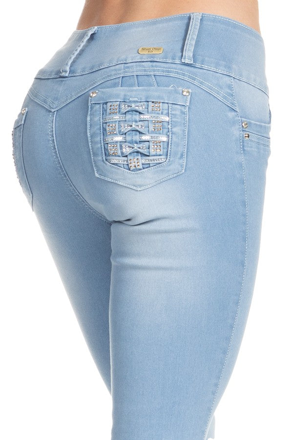 Light blue jeans with decorative stitching on a white background