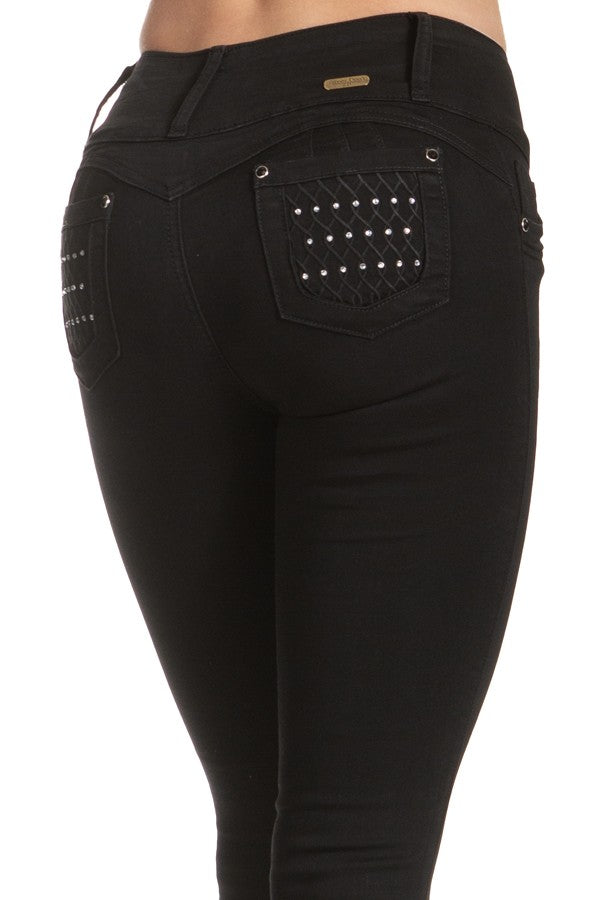 Black pants with studded detailing on a white background