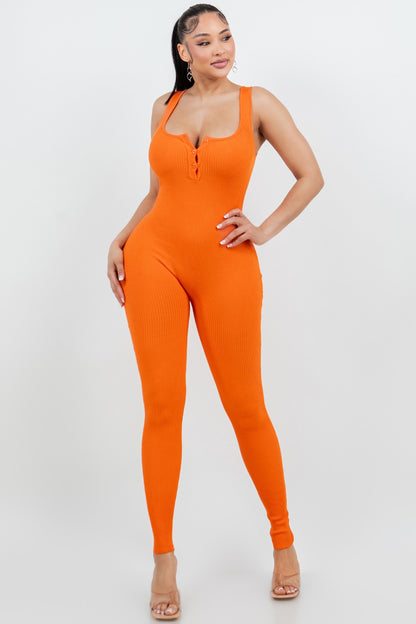 Woman wearing an orange jumpsuit on a white background