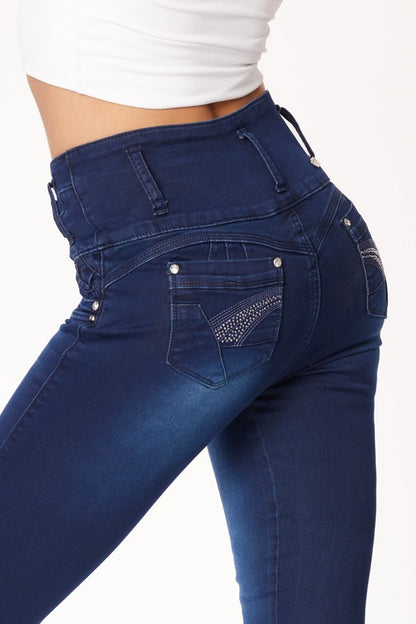 Blue jeans with decorative stitching on a white background