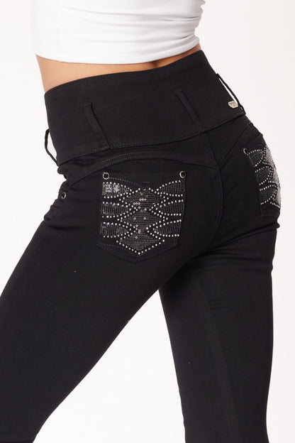 Black pants with embellished pocket on a white background