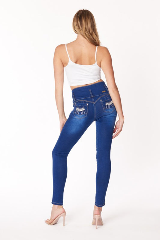 Woman wearing blue jeans and a white top on a white background