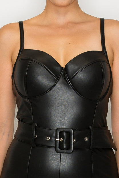 Black leather outfit with a belt on a plain background