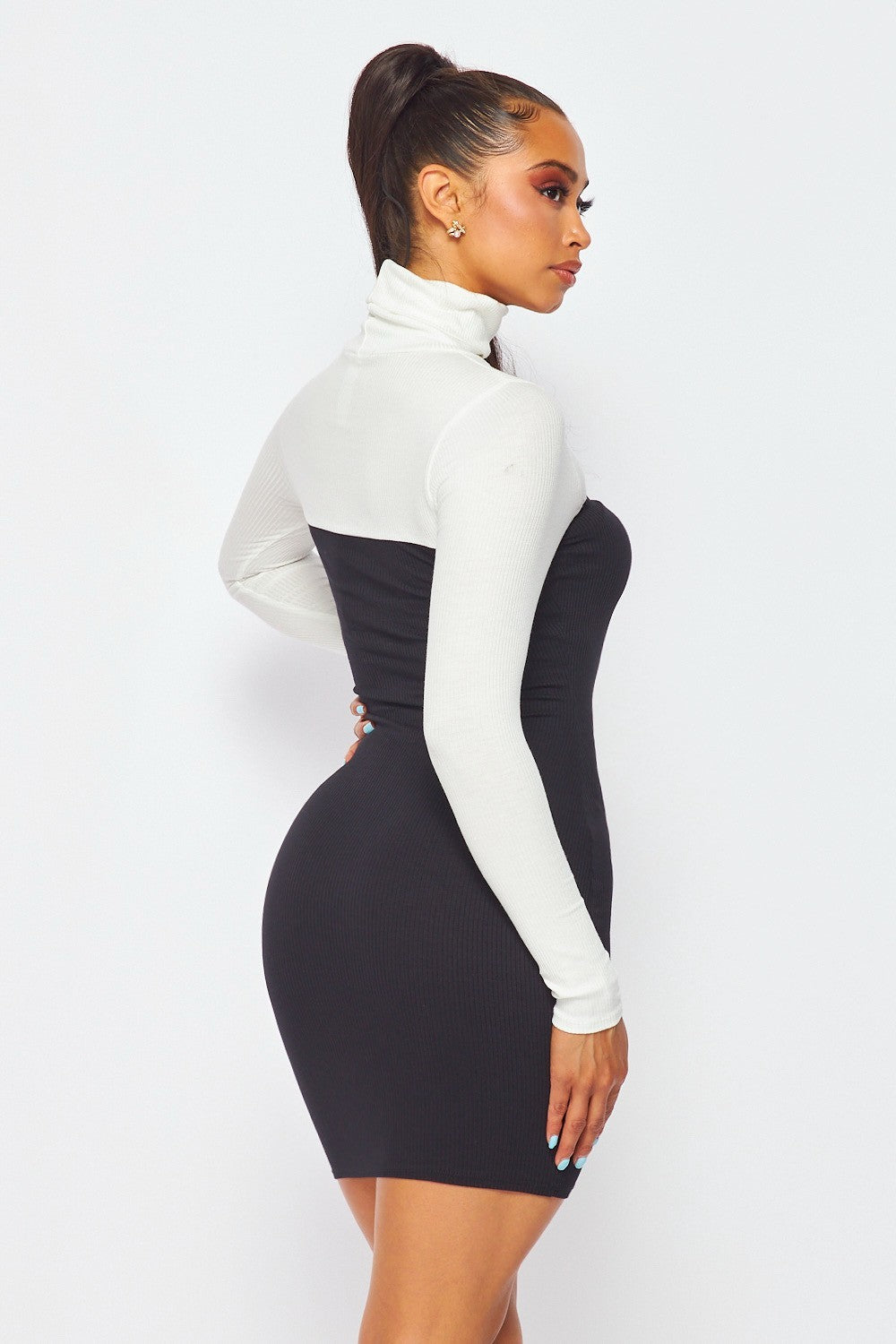 Contrast Cutout Turtleneck Bodycon Dress on a model 