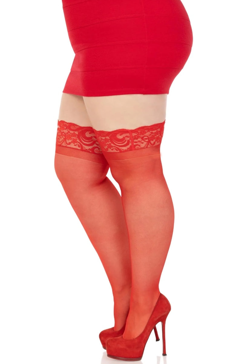 Red sheer stockings with lace top worn by a person on a white background