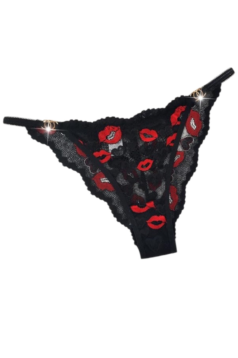 Black lace thong with red lip print on a white background.