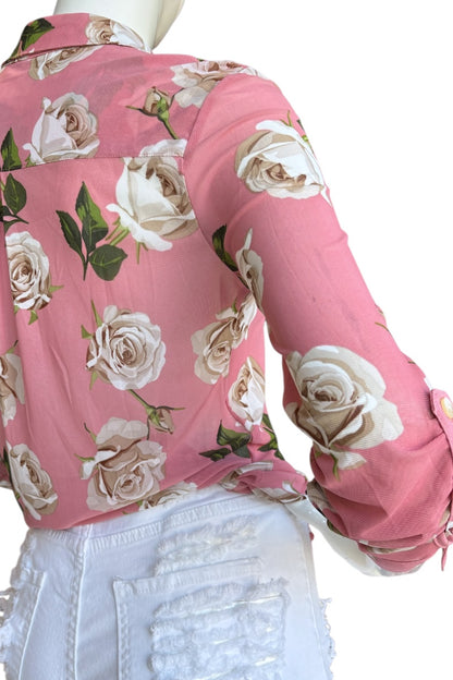 Pink floral blouse on a mannequin with a white background