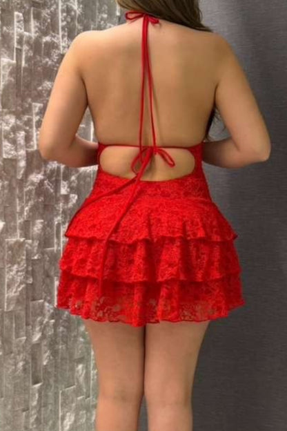 Red lace halter top and skirt set against a textured gray background