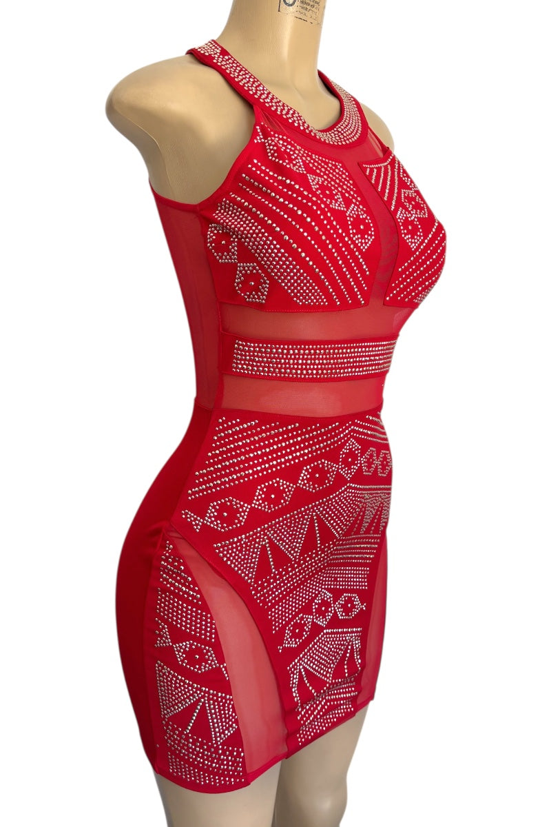 Red dress with studded patterns on a mannequin against a white background
