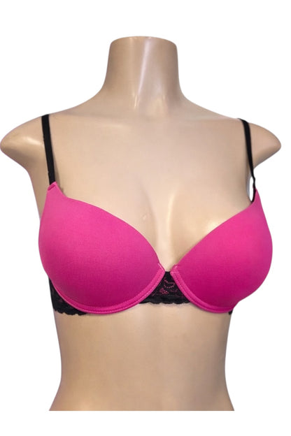 Pink bra on a mannequin with a white background