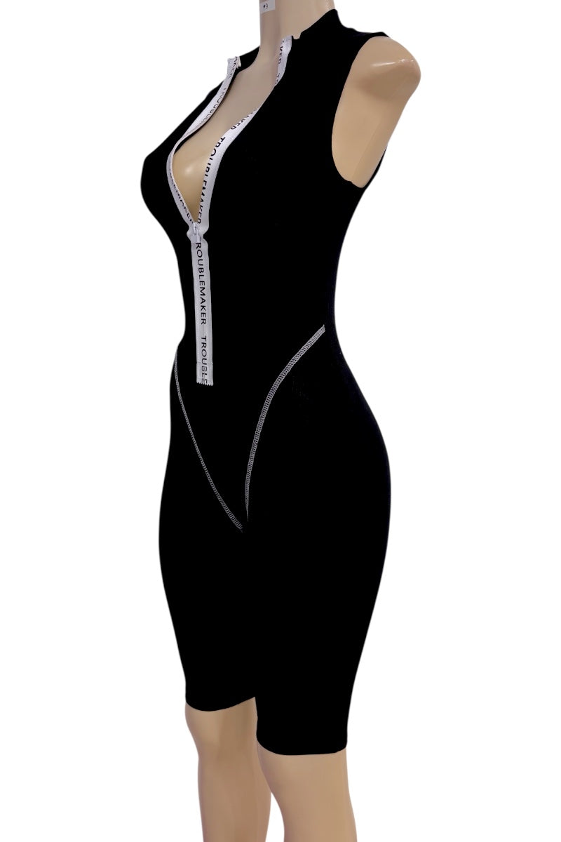A black sleeveless bodycon romper with a deep plunging V-neckline, shown on a beige mannequin torso against a plain white background.