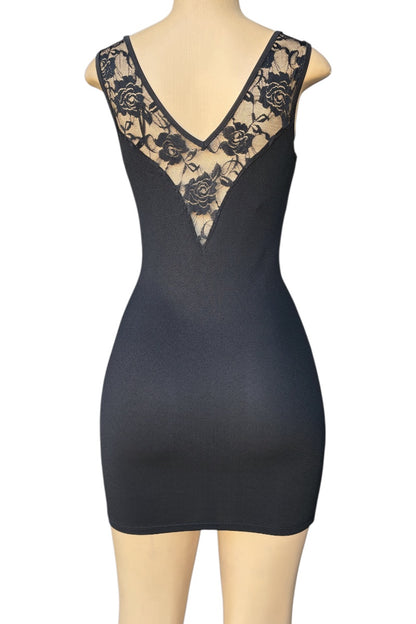 Black dress with lace detailing on a mannequin against a white background