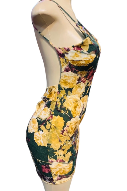 Floral dress on a mannequin against a white background