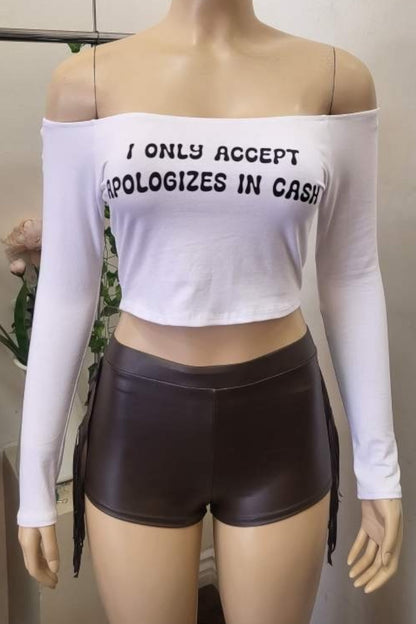Mannequin wearing a white off-shoulder top with text and black shorts.