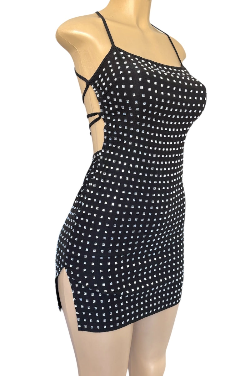 Black rhinestone dress on a mannequin against a white background