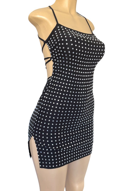 Black rhinestone dress on a mannequin against a white background