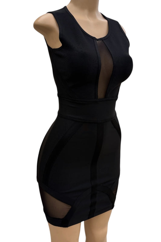 Black dress with sheer panels on a mannequin against a white background