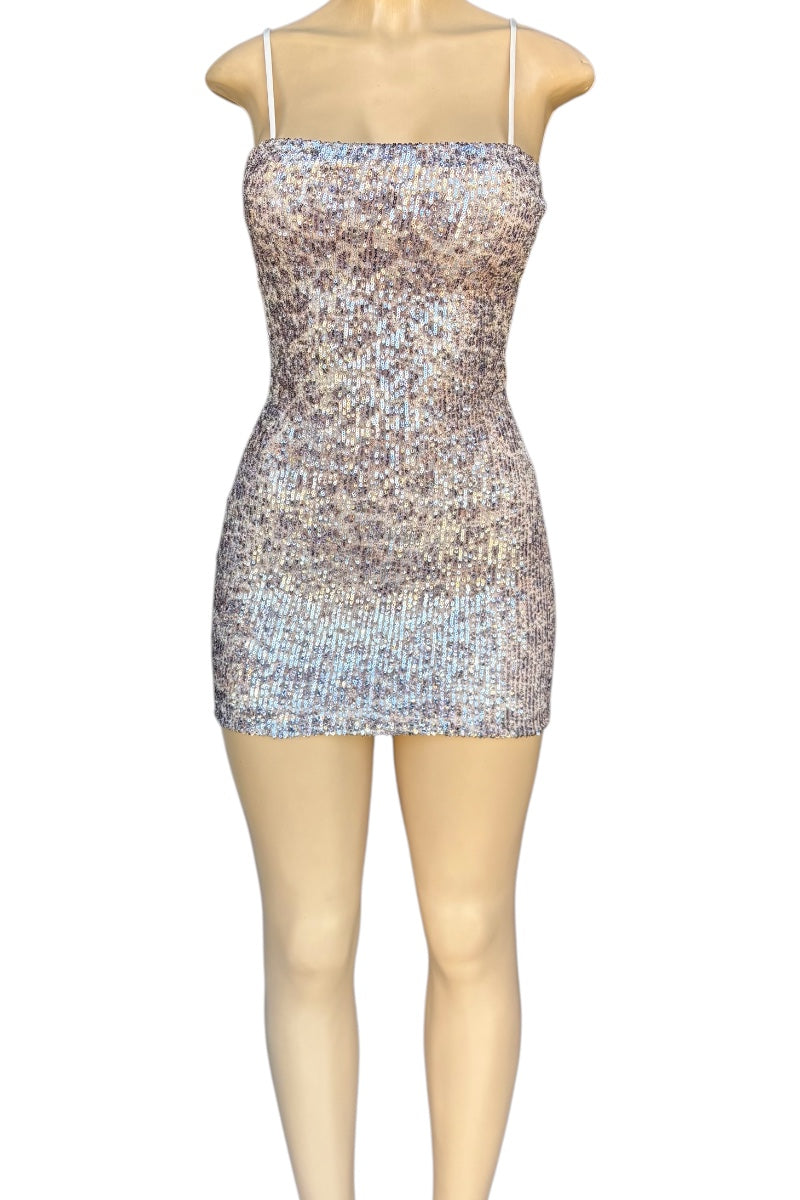Sparkly dress on a mannequin against a white background