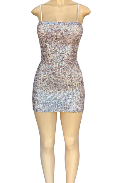 Sparkly dress on a mannequin against a white background