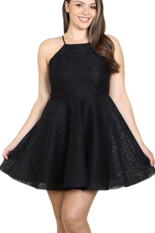 Woman wearing a black lace dress on a white background