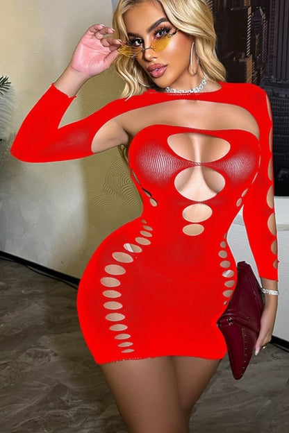 Woman wearing a red dress with cut-out design, holding a red clutch.