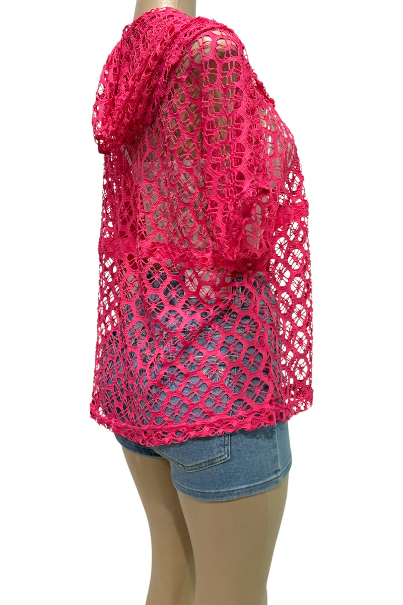 Pink crochet top worn by a mannequin on a white background