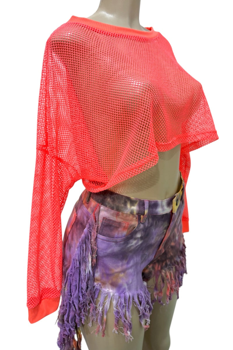 Mannequin wearing a bright orange mesh top and colorful skirt on a white background
