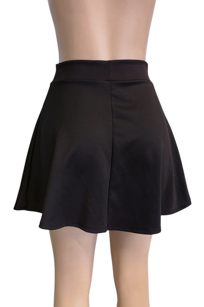 A black flared mini skirt shown from the back on a mannequin torso and legs against a plain white background.