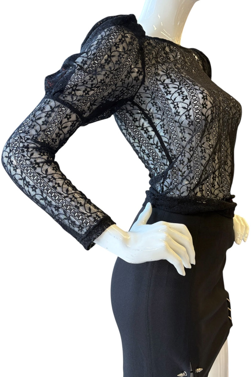 Black lace top and skirt set on a mannequin against a white background