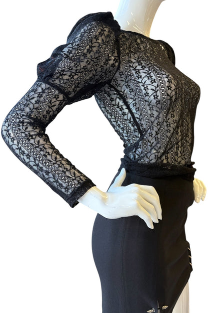 Black lace top and skirt set on a mannequin against a white background