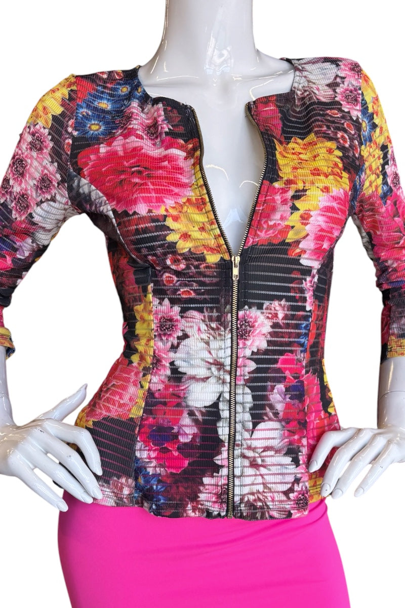 Mannequin wearing a colorful floral jacket with a white background