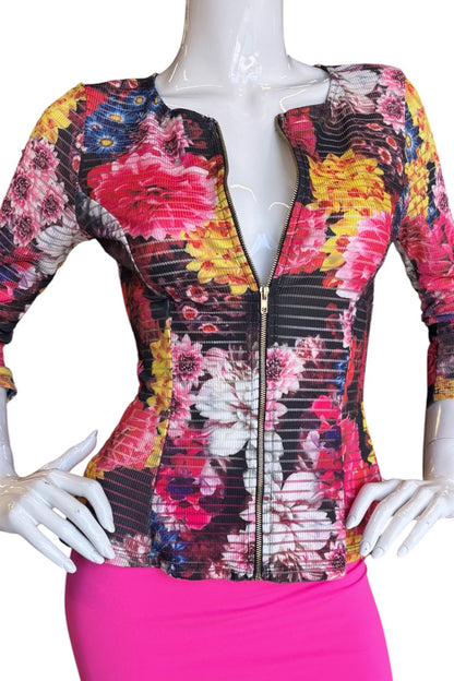 Mannequin wearing a colorful floral jacket with a white background