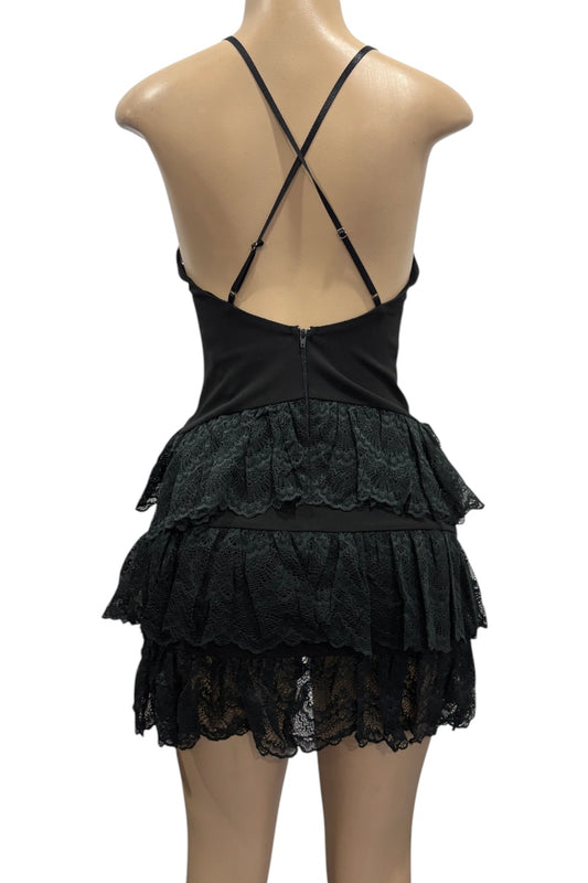 Black lace dress on a mannequin with a white background