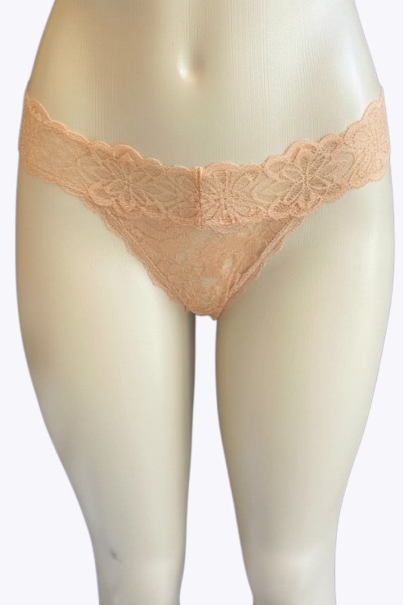 Beige lace underwear on a mannequin against a white background