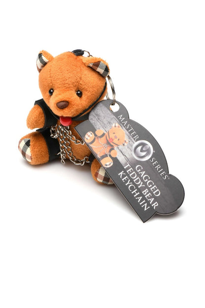 Plush toy bear keychain with a tag on a white background