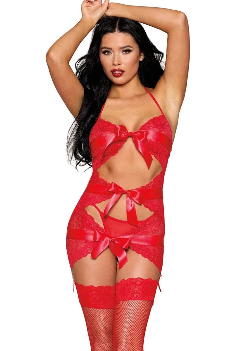 Woman wearing a red lingerie set with bows on a white background