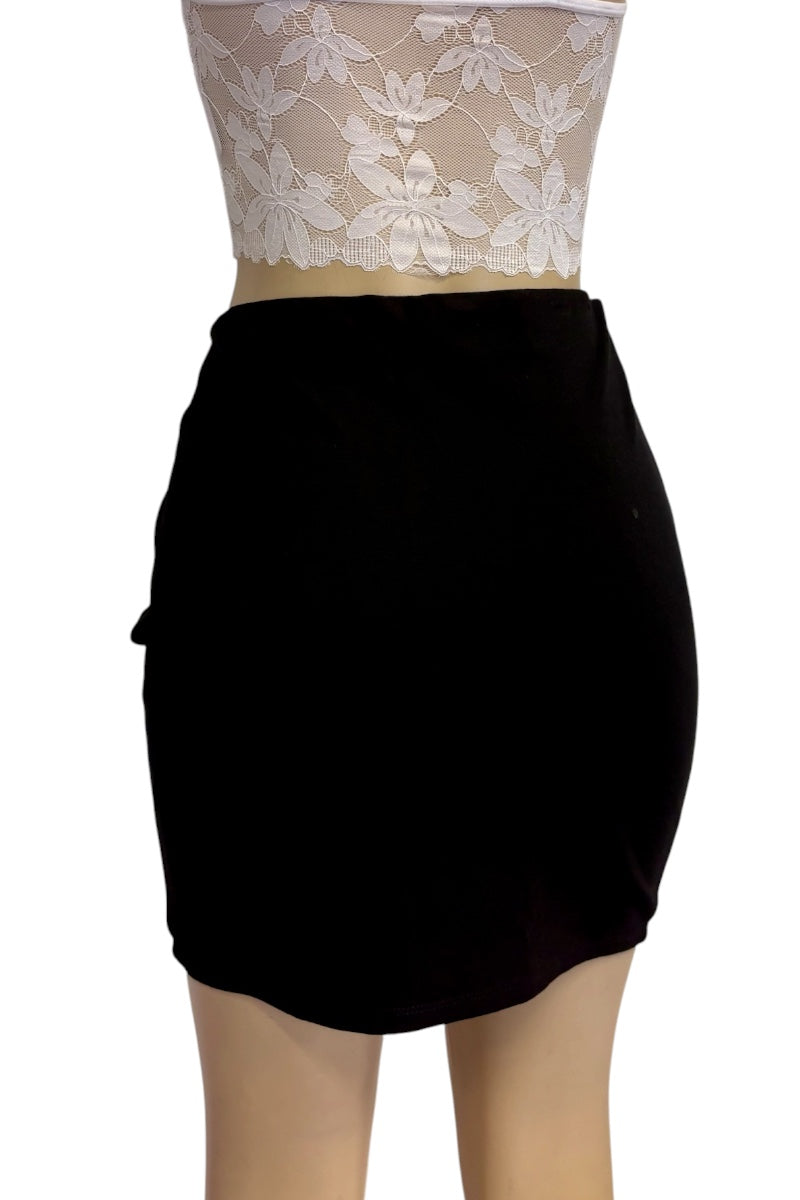 A black high-waisted mini skirt shown on a mannequin torso, paired with a white floral lace top against a plain white background.