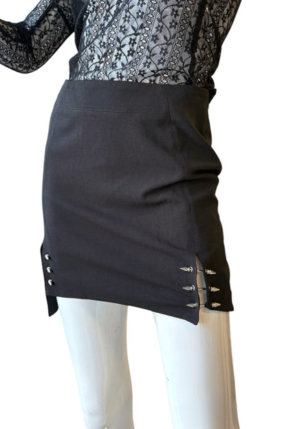 Black skirt with decorative designs on a white background
