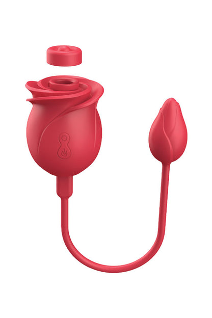 A red silicone intimate product shaped like a rose with a detached cap above it and a separate bulb-shaped component to the right, shown on a plain white background.