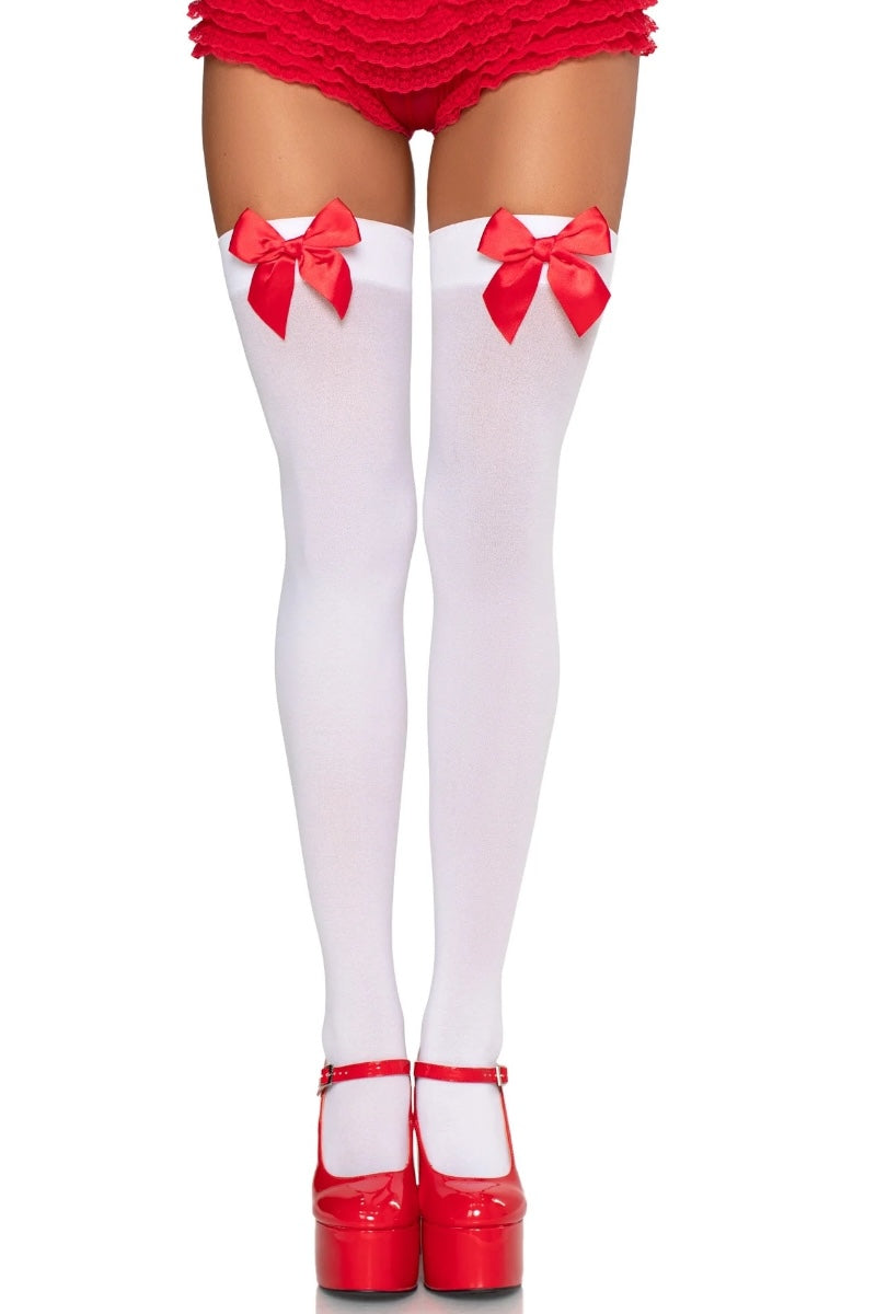 White thigh-high socks with red bows and red shoes on a white background