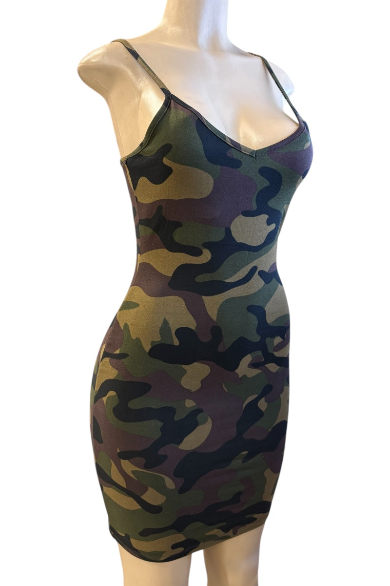 Camouflage-patterned dress on a mannequin against a white background