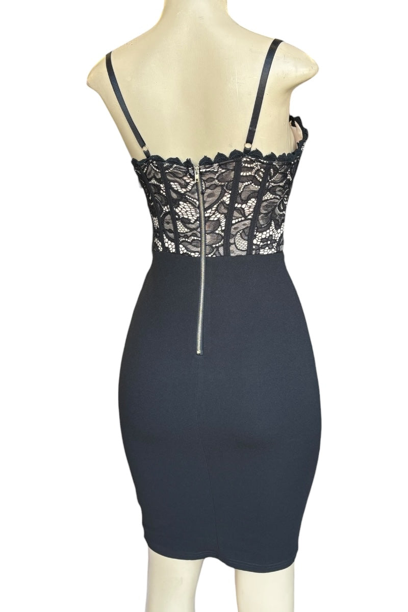 Black lace dress on a mannequin against a white background