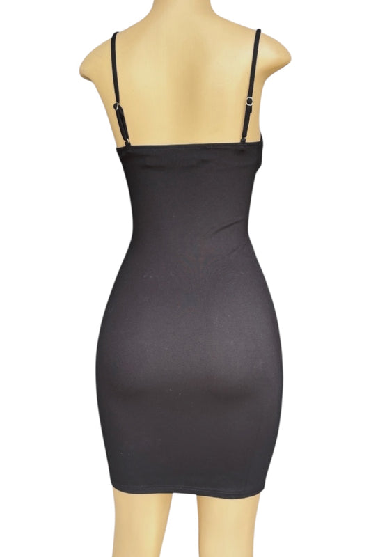 Black dress on a mannequin against a white background