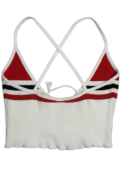 White crop top with red and black accents on a white background